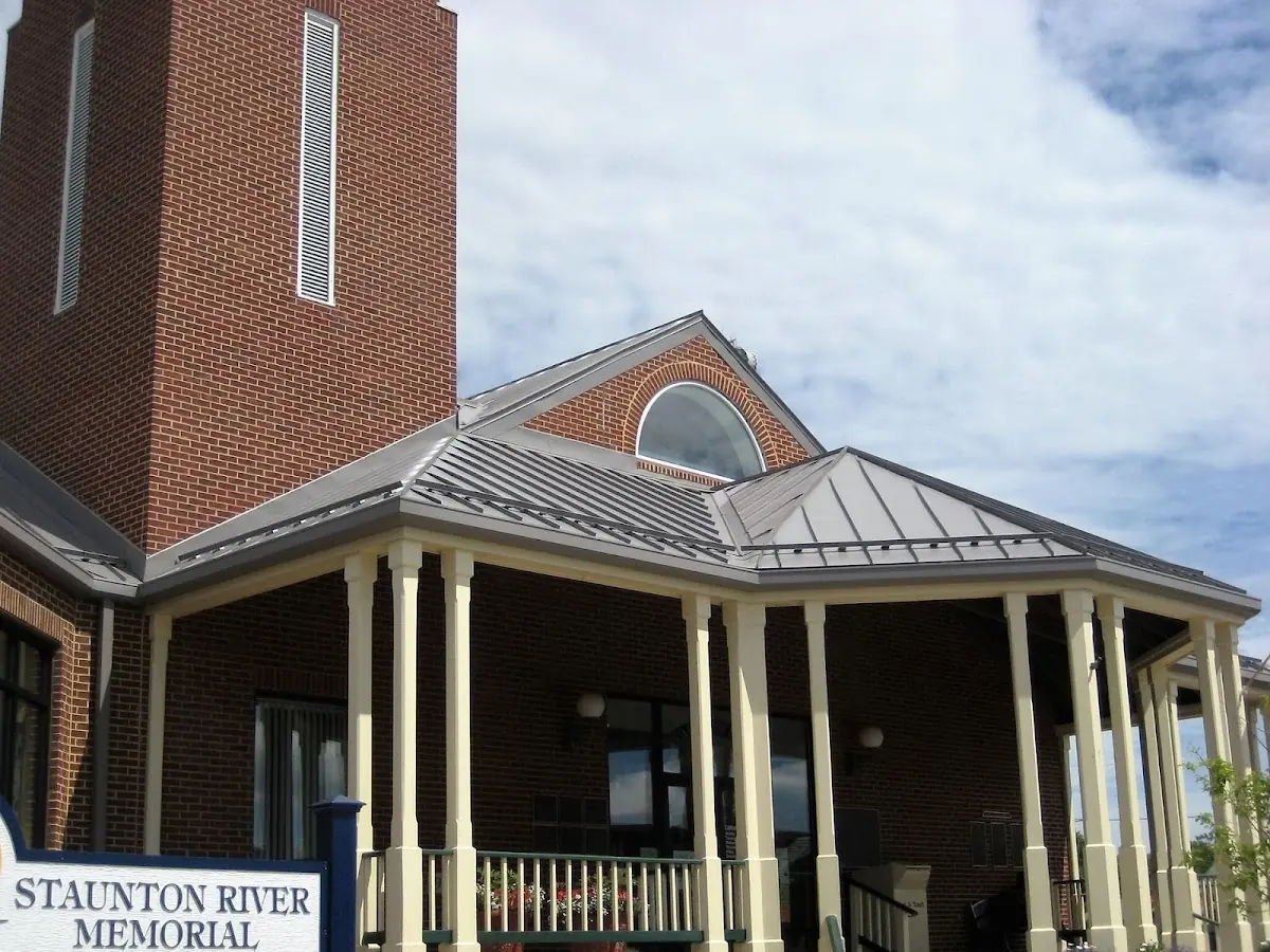 Skilled roofing craftsmen working on a residential roof in Jakesville
